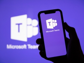 Microsoft Teams logo on a phone and a screen.